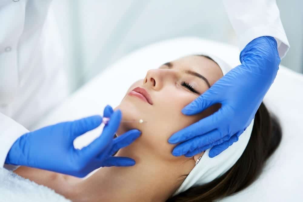 Young Woman Getting Polydioxanone Thread Lifting at Beauty Salon